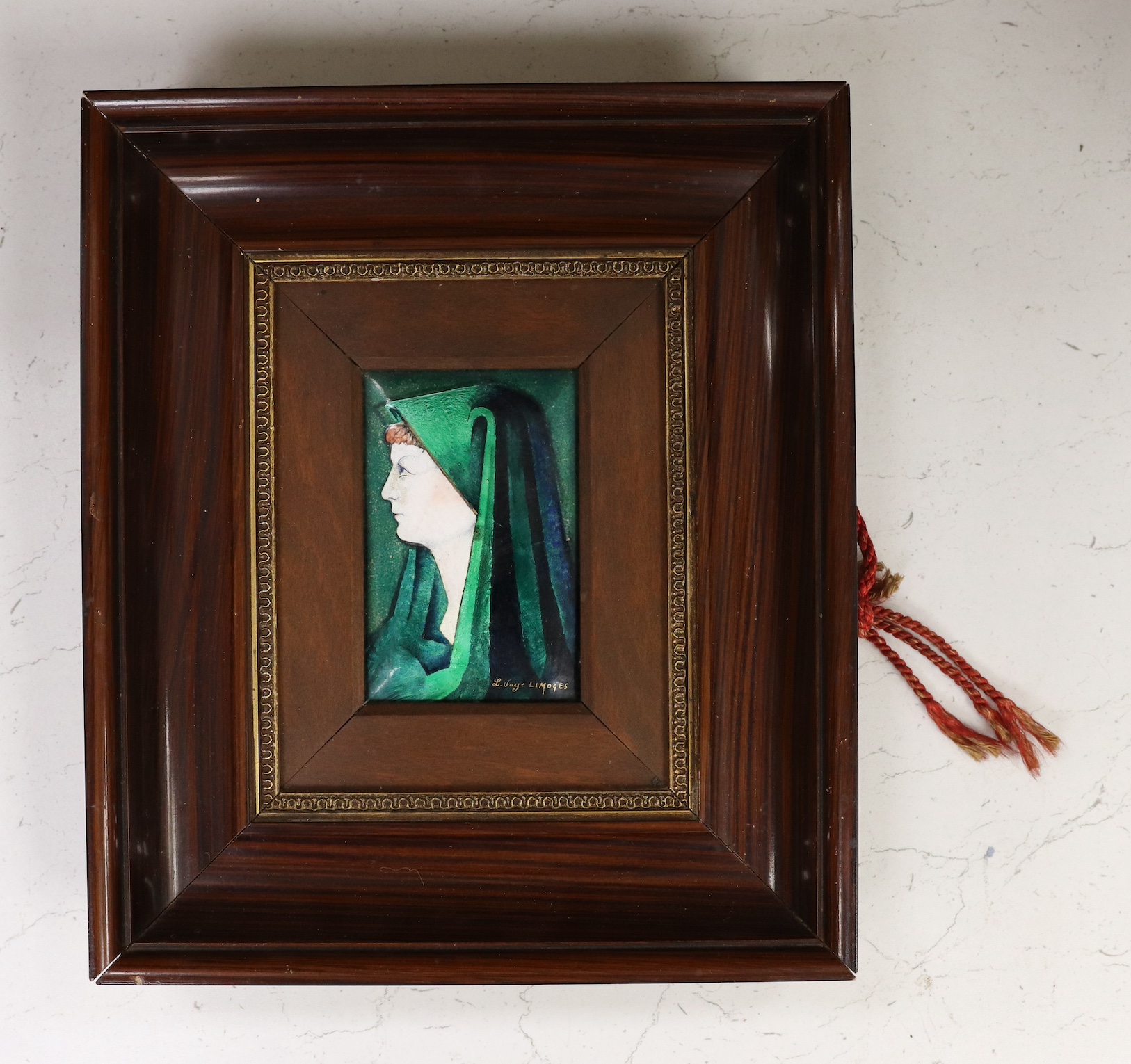 A framed Limoges plaque, signed L. Faye Limoges, frame 29cm high, 25cm wide. Condition - fair to good